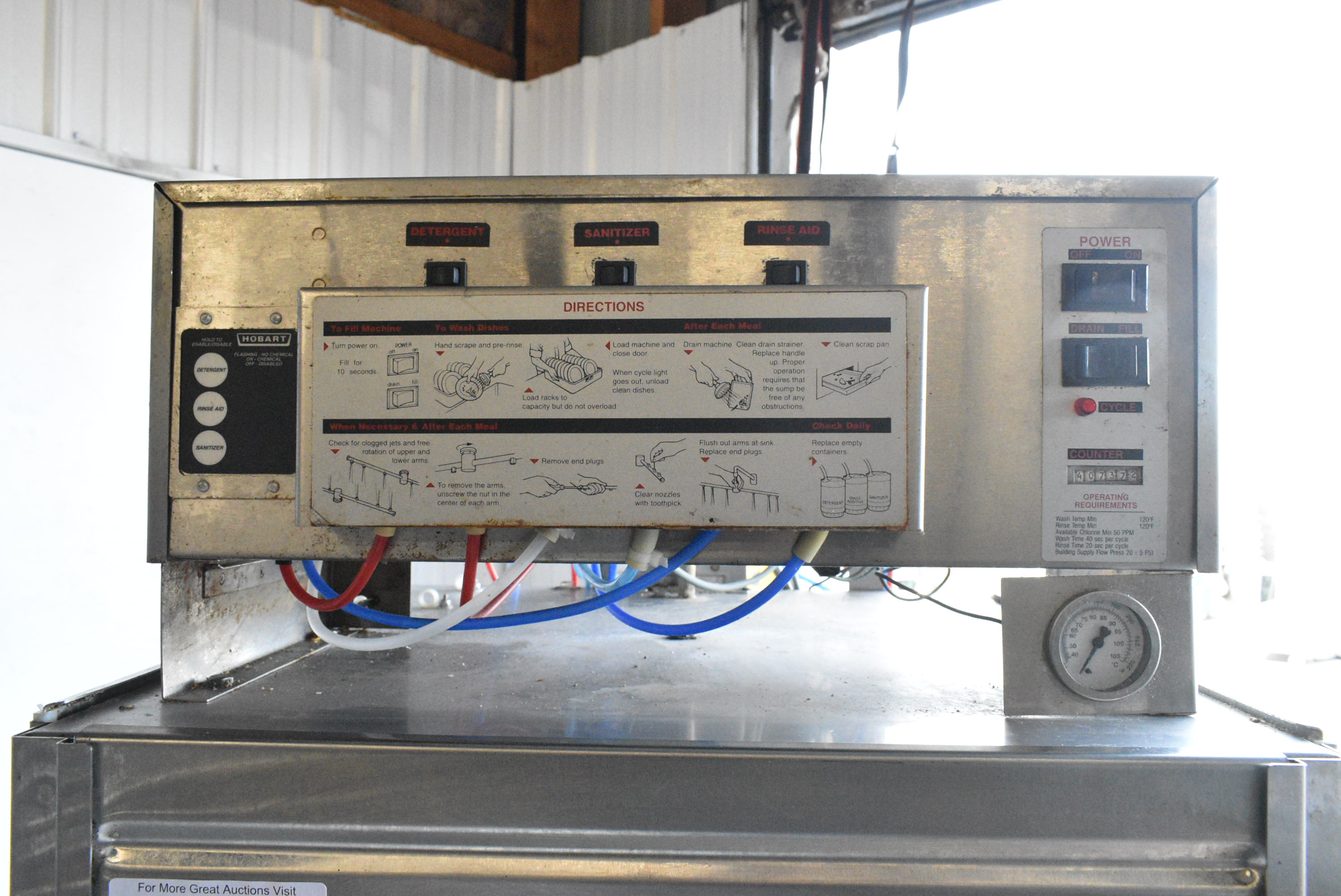 Older mechanical style control panel on commercial dishwasher