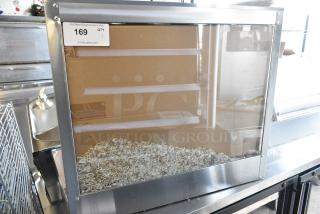 BRAND NEW SCRATCH AND DENT! Stainless Steel Commercial Countertop Heated Display Case Merchandiser. See Pictures for Broken Glass. 110 Volts, 1 Phase. Tested and Working!