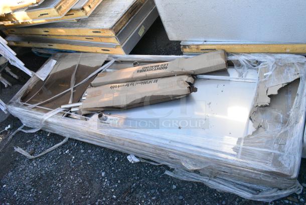 BRAND NEW SCRATCH AND DENT! Regency 600WT30X96BS 30" x 96" 16-Gauge 304 Stainless Steel Commercial Open Base Work Table with 4" Backsplash. May Be Missing Pieces. - Image 1 of 3