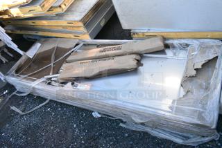BRAND NEW SCRATCH AND DENT! Regency 600WT30X96BS 30" x 96" 16-Gauge 304 Stainless Steel Commercial Open Base Work Table with 4" Backsplash. May Be Missing Pieces.