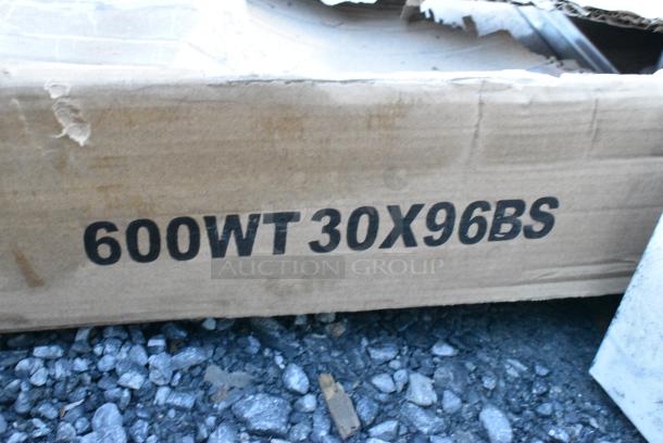 BRAND NEW SCRATCH AND DENT! Regency 600WT30X96BS 30" x 96" 16-Gauge 304 Stainless Steel Commercial Open Base Work Table with 4" Backsplash. May Be Missing Pieces. - Image 3 of 3