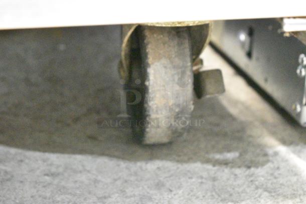 Atosa MGF8404 Stainless Steel Commercial 3 Door Undercounter Cooler on Commercial Casters. 115 Volts, 1 Phase. Tested and Powers On But Does Not Get Cold - Image 5 of 9