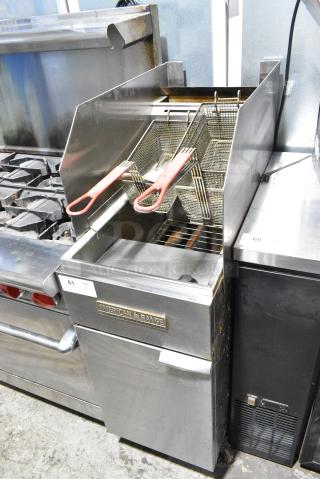 American Range AF-35/50 Stainless Steel Commercial Floor Style Natural Gas Powered Deep Fat Fryer w/ 2 Metal Fry Baskets and 2 Side Splash Guards on Commercial Casters. 40,000 BTU.