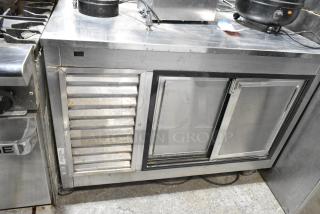 Leader LB48 S/C Stainless Steel Commercial 2 Door Undercounter Cooler on Commercial Casters. 115 Volts, 1 Phase. Tested and Powers On But Does Not Get Cold