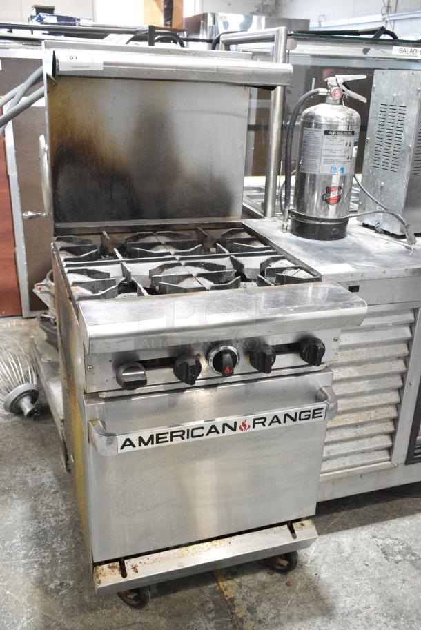 American Range Stainless Steel Commercial Natural Gas Powered 4 Burner Range w/ Oven, Over Shelf and Back Splash on Commercial Casters. - Image 1 of 13