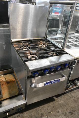 Imperial IR-4 Stainless Steel Commercial Natural Gas Powered 4 Burner Range w/ Oven and Back Splash.