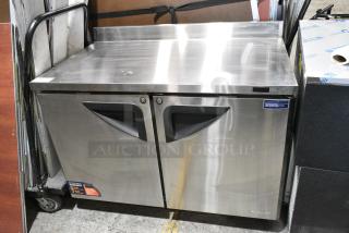 BRAND NEW SCRATCH AND DENT! Turbo Air TWF-48SD-N Stainless Steel Commercial 2 Door Work Top Freezer on Commercial Casters. 115 Volts, 1 Phase. Tested and Working! - Item #1154135