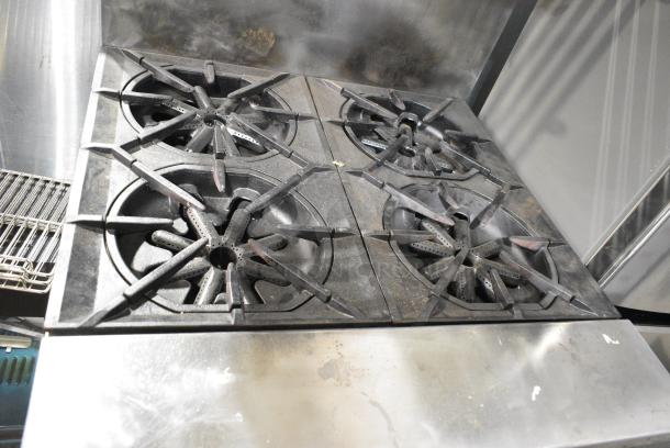 Garland Stainless Steel Commercial Natural Gas Powered 4 Burner Range w/ Oven, Over Shelf and Back Splash on Commercial Casters. - Image 3 of 7
