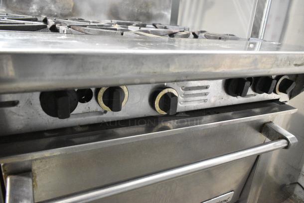 Garland Stainless Steel Commercial Natural Gas Powered 4 Burner Range w/ Oven, Over Shelf and Back Splash on Commercial Casters. - Image 5 of 7
