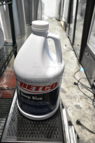 11 BRAND NEW SCRATCH AND DENT! Betco Deep Blue Glass and Surface Cleaner Jugs. 11 Times Your Bid!