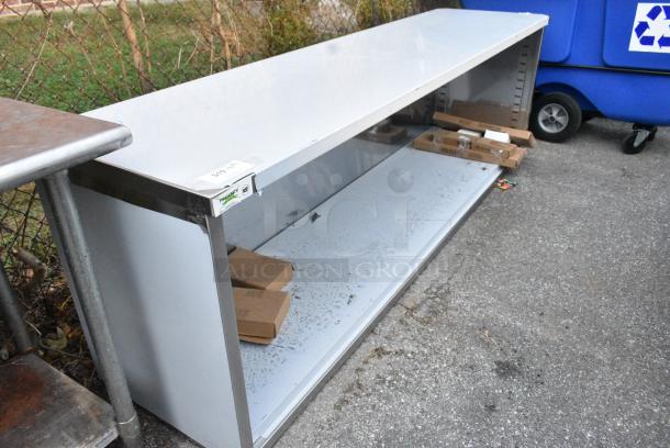 BRAND NEW SCRATCH AND DENT! Regency 600EBT2496 24" x 96" 16 Gauge Type 304 Stainless Steel Enclosed Base Table with Open Front and Adjustable Midshelf - Image 2 of 6