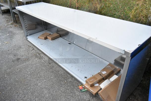 BRAND NEW SCRATCH AND DENT! Regency 600EBT2496 24" x 96" 16 Gauge Type 304 Stainless Steel Enclosed Base Table with Open Front and Adjustable Midshelf - Image 3 of 6