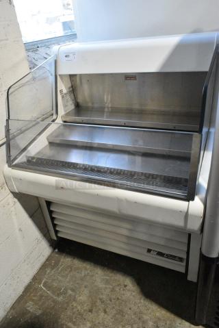 2017 True THAC-36 Metal Commercial Open Grab N Go Merchandiser on Commercial Casters. 115 Volts, 1 Phase. Tested and Powers On But Does Not Get Cold