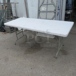 One White Folding Table. 72X30X28