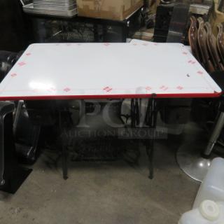 One Vintage Enamel Kitchen Table Top On A Vintage Metal Singer Sewing Machine Base.  40X25X29