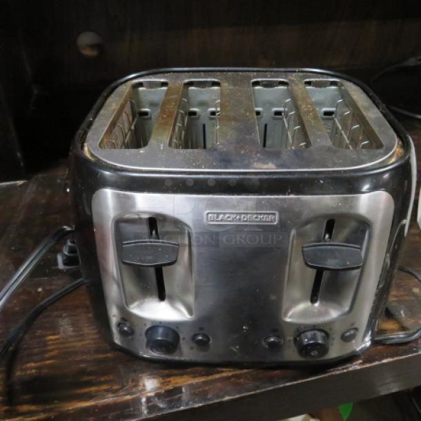 One Black And Decker 4 Slice Toaster. - Image 1 of 1