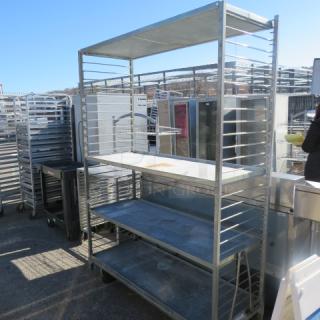 One Shelving System With 4 Solid Metal Shelves On Casters. 56X21X78