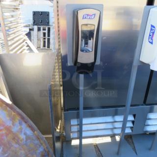 One Black Purell Hand Sanitizing Station.