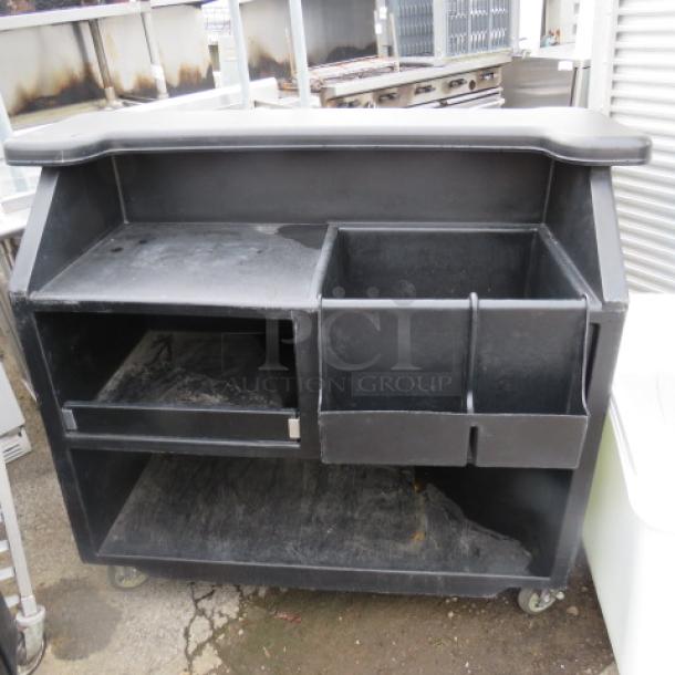 One Black Poly Portable Bar With Ice Well, Storage Serving Shelf, And A Bottle Rail On Casters. 53X32X47 - Image 2 of 2