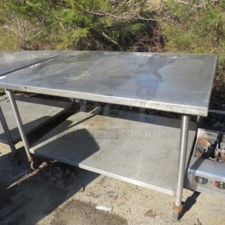 One Stainless Steel Table With A SS Under Shelf On Casters. 60X45X36