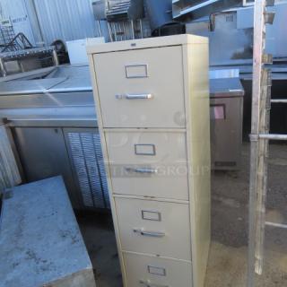 One 4 Drawer Metal File Cabinet. 15X25X52