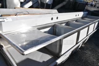 BRAND NEW SCRATCH AND DENT! Regency 600S42424224 Stainless Steel 4 Bay Sink w/ Dual Drain Boards. No Legs. - Item #1155263