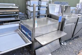 Stainless Steel Counter w/ Under Shelf on Commercial Casters.