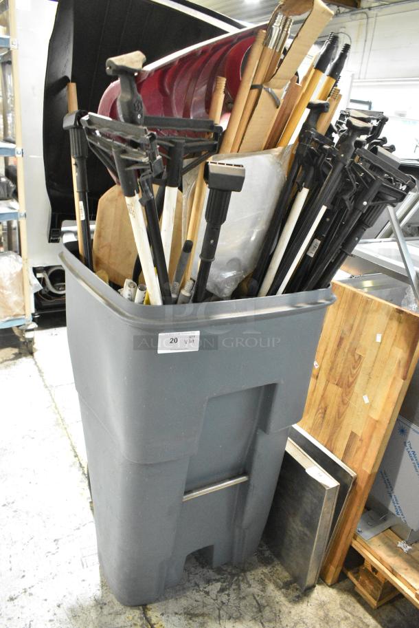 ALL ONE MONEY! Lot of BRAND NEW! Items Including Gray Poly Trash Can w/ Contents Including Mop Handles. - Image 1 of 4