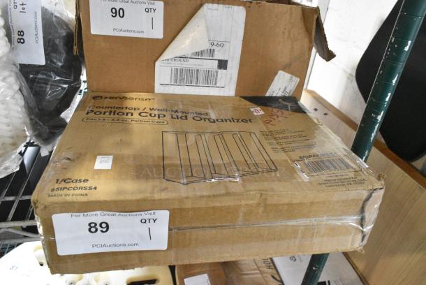 BRAND NEW IN BOX! 651PCORSS4 ServSense Adjustable 4-Section Stainless Steel Wall-Mount / Countertop 1.5 - 5.5 oz. Portion Cup / Lid Organizer - Image 1 of 2