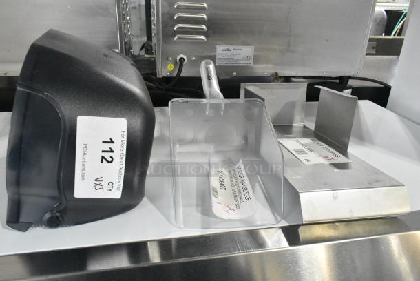 3 BRAND NEW SCRATCH AND DENT! Items Including Scotsman KHOLDER Stainless Steel Scoop Holder, 271436407 Carlisle 436407 Spectrum 64 oz. Clear Polycarbonate Utility Scoop, San Jamar Poly Wall Mount Toilet Paper Dispenser. 3 Times Your Bid! - Image 1 of 8