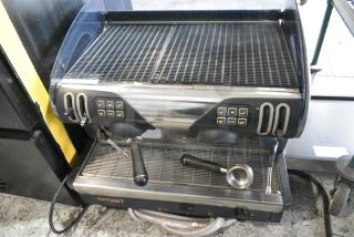 Faema Giugiaro Design Stainless Steel Commercial Countertop 2 Group Espresso Machine w/ Portafilter and 2 Steam Wands. 208 Volts, 1 Phase.