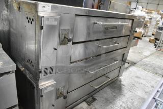 2 Bakers Pride Stainless Steel Commercial Natural Gas Powered Single Deck Pizza Oven. Appears to be Model Y600. 2 Times Your Bid!
