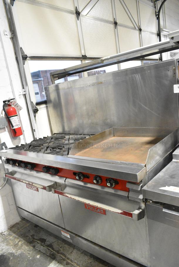 Vulcan 60FTL Stainless Steel Commercial Propane Gas Powered 6 Burner Range w/ Right Side Flat Top Griddle, 2 Ovens and Back Splash. - Image 1 of 9