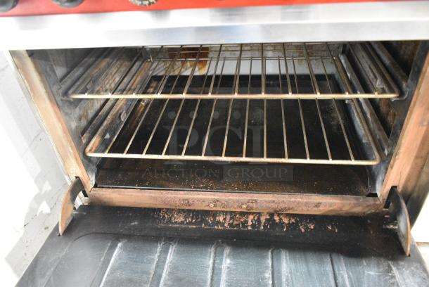 Vulcan 60FTL Stainless Steel Commercial Propane Gas Powered 6 Burner Range w/ Right Side Flat Top Griddle, 2 Ovens and Back Splash. - Image 6 of 9