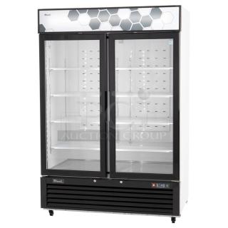 BRAND NEW SCRATCH AND DENT! 2022 Migali C-49FM-HCe Metal Commercial 2 Door Reach In Freezer Merchandiser w/ Poly Coated Racks on Commercial Casters. Serial C-49FM-HCe003221215092C0011. 115 Volts, 1 Phase. Tested and Working!