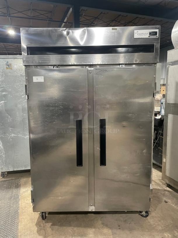 Delfield Commercial Stainless Steel Solid Double Door Reach In Refrigerator! With Poly Coated Wire Racks! Model: 6051XL-S SN: 1204152001884! 115V 1 Phase! On Casters! - Image 1 of 10