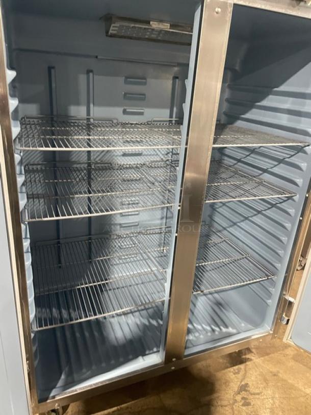 Delfield Commercial Stainless Steel Solid Double Door Reach In Refrigerator! With Poly Coated Wire Racks! Model: 6051XL-S SN: 1204152001884! 115V 1 Phase! On Casters! - Image 5 of 10