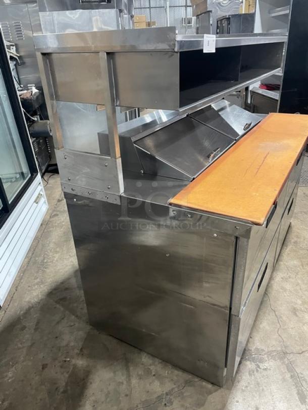 Delfield Commercial Stainless Steel 4 Drawer Refrigerated Mega Top Salad/Sandwich Prep Table! With Enclosed Storage Base Type Shelf Overhead! With Wooden Chopping Block Style Workstation! Model: UCD4464N-12-DD5 SN: 1303152000466! 115V 1Phase! - Image 2 of 10