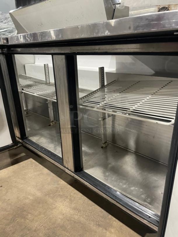 True Commercial Stainless Steel 3 Door Refrigerated Mega Top Salad/Sandwich Prep Table! With Poly Coated Wire Racks! Model: TSSU-72-12 SN: 7868756! 115V 1 Phase! On Casters! - Image 6 of 9