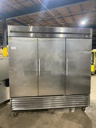 True Commercial Stainless Steel Solid 3 Door Reach In Refrigerator! With Poly Coated Wire Racks! Model: T-72 SN: 1-2432016! 115V 1 Phase! On Casters! Working When Removed! - Item #1155874