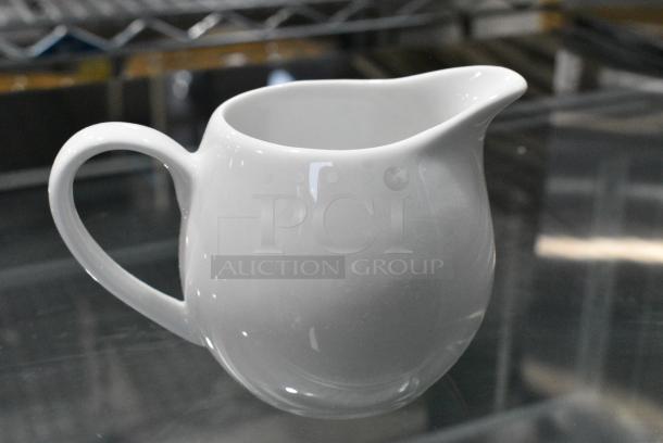 2 BRAND NEW SCRATCH AND DENT! Items Including GET SD-08-IV 8 oz. Ivory Oval Side Dish / Au Gratin - 24/Case and Box of Ceramic Pitchers. 2 Times Your Bid! - Image 1 of 7