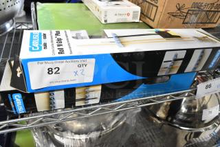2 BRAND NEW SCRATCH AND DENT! 4073700 Carlisle Roll 'N Grip Plus 4073700 16 1/2" Broom and Brush Holder. 2 Times Your Bid!