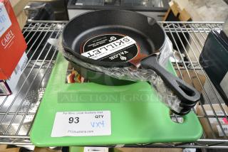 4 BRAND NEW SCRATCH AND DENT! Items Including CB121812GN San Jamar CB121812GN Cut-N-Carry® 18" x 12" x 1/2" Green Cutting Board with Hook and 3 825RSK9 Valor 9" Pre-Seasoned Cast Iron Skillet. 4 Times Your Bid!