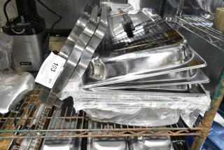 12 BRAND NEW SCRATCH AND DENT! Items Including Metal Folding Chafer Frame, 3 Chafer Lids and Chafer Drop Ins. 12 Times Your Bid!