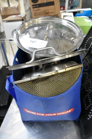 6 Various Items Including Metal Stock Pot Lids, Strainer and Blue Bag. 6 Times Your Bid!
