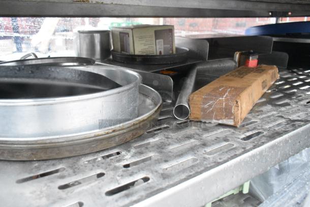 Chrome Finish 5 Tier Wire Shelving Unit on Commercial Casters w/ Contents Including Pizza Pan Rack, Metal Stock Pots, Gas Hoses, Round Metal Pans. BUYER MUST DISMANTLE. PCI CANNOT DISMANTLE FOR SHIPPING. PLEASE CONSIDER FREIGHT CHARGES. - Image 6 of 11