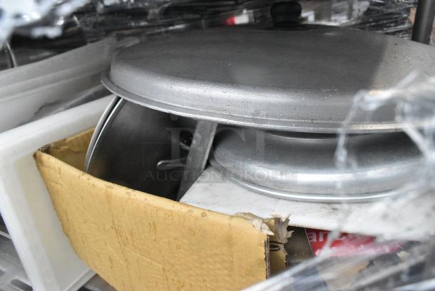Chrome Finish 5 Tier Wire Shelving Unit on Commercial Casters w/ Contents Including Pizza Pan Rack, Metal Stock Pots, Gas Hoses, Round Metal Pans. BUYER MUST DISMANTLE. PCI CANNOT DISMANTLE FOR SHIPPING. PLEASE CONSIDER FREIGHT CHARGES. - Image 10 of 11