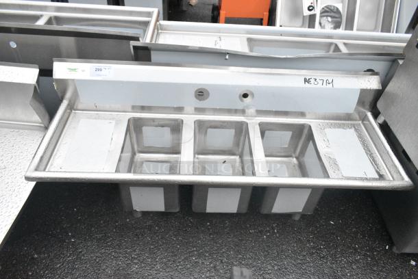 BRAND NEW SCRATCH AND DENT! Regency 600S31014212 58" 16-Gauge Stainless Steel Three Compartment Commercial Sink w/  2 Drainboards - 10" x 14" x 10" Bowls. No Legs. - Image 1 of 4