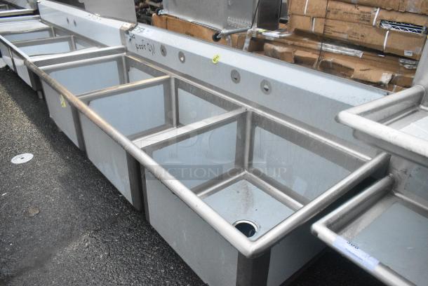 BRAND NEW SCRATCH AND DENT! Regency 600S32424 124" 16-Gauge Stainless Steel Three Compartment Commercial Sink with 2 Drainboards - 24" x 24" x 14" Bowls. No Legs. - Image 1 of 4