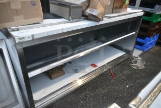 BRAND NEW SCRATCH AND DENT! Regency 600EBT3072D 30" x 72" 16 Gauge Type 304 Stainless Steel Enclosed Base Table with Sliding Doors and Adjustable Midshelf